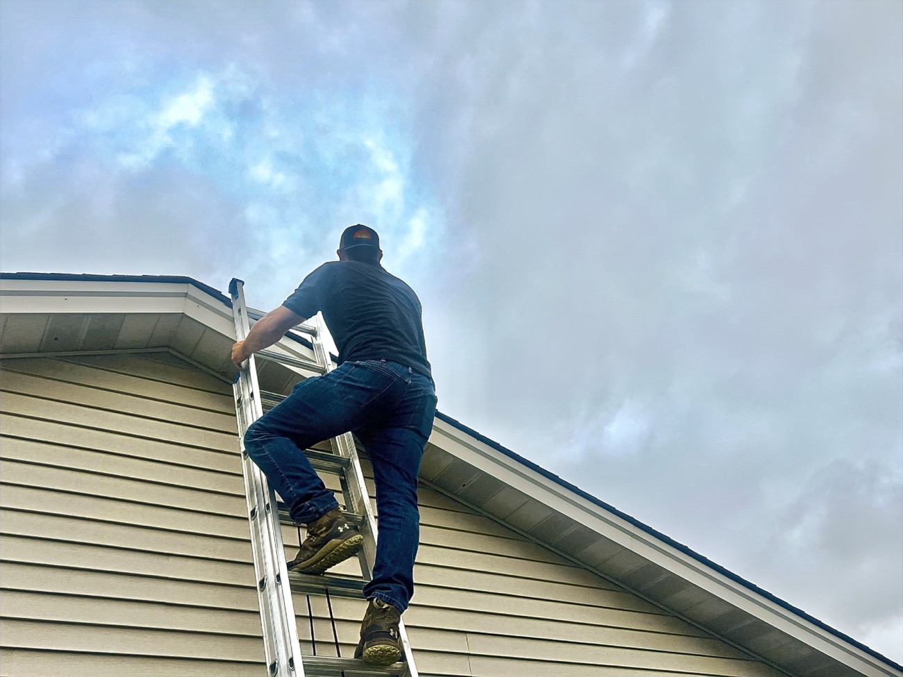 AllGood crew member servicing the gutter and soffit line on a Hamilton, OH home