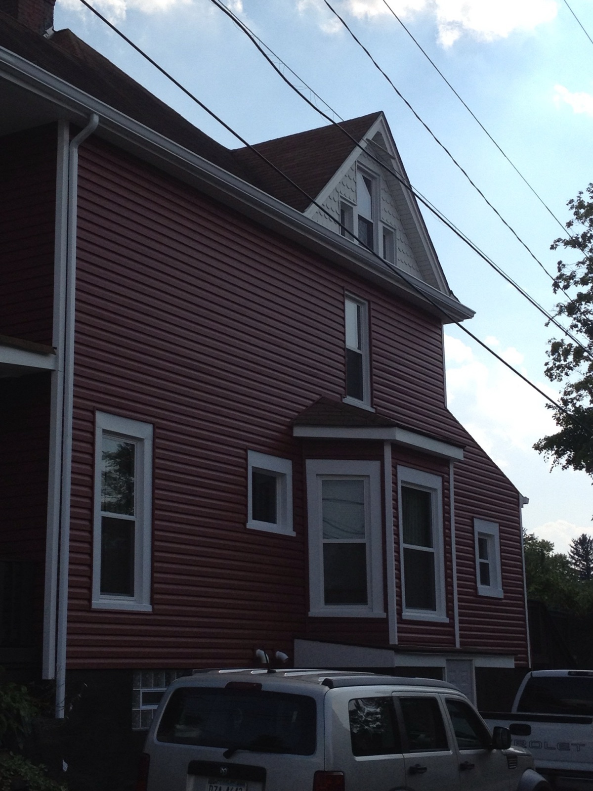The same home after AllGood installed new low-maintenance siding and fresh white trim