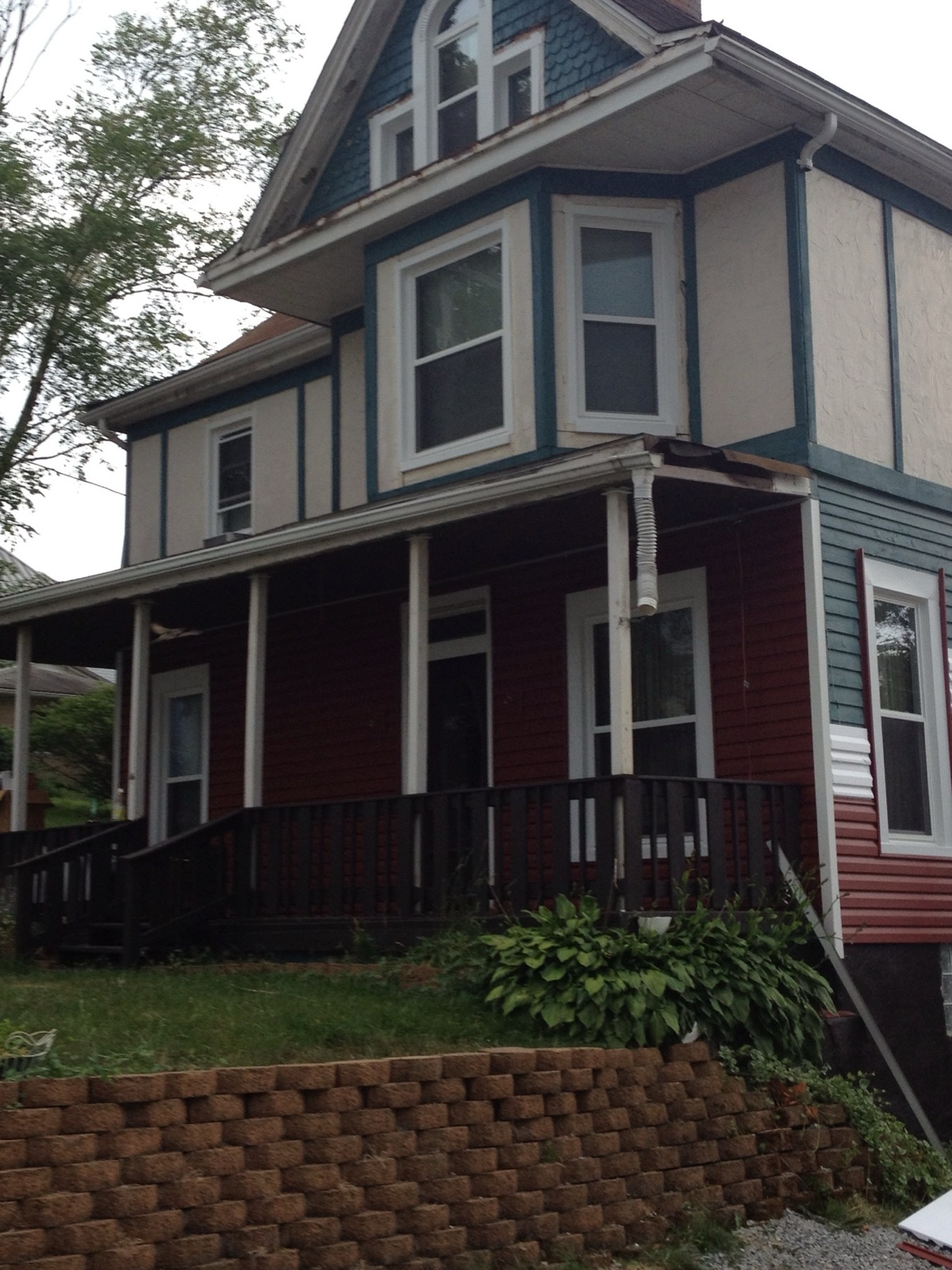 Older home with worn, mismatched siding and trim before AllGood's replacement